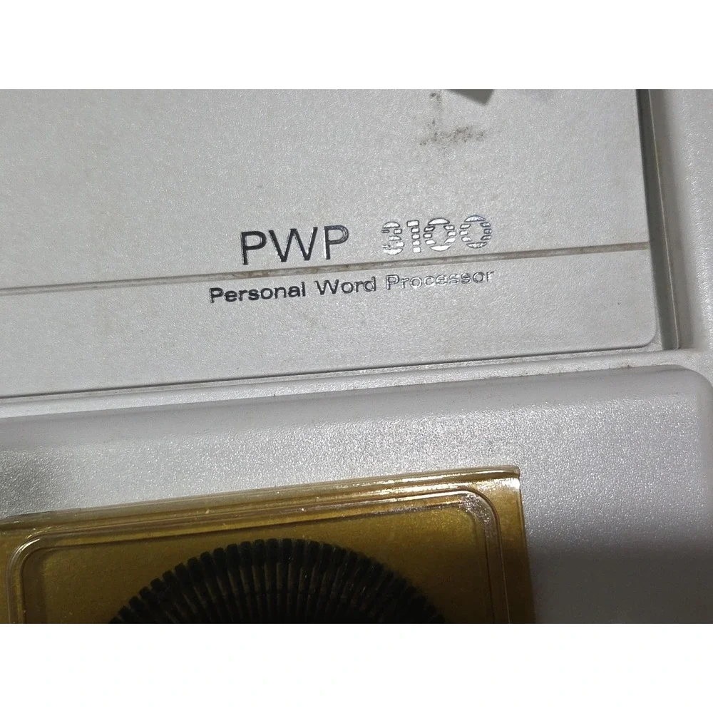 Smith Corona PWP 3100 Word Processor with accessories, manual, ribbons, and type